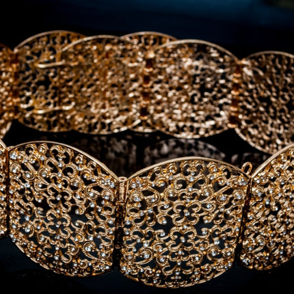 Gouden ovalen riem