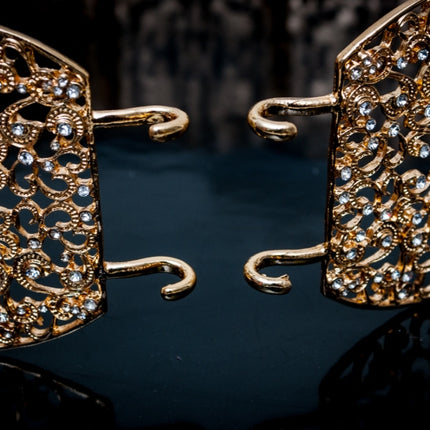 Gouden ovalen riem