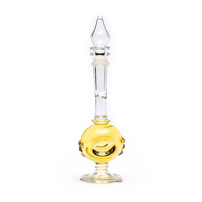 Scented oil in a hand-blown rose bottle
